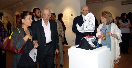 	Visitors to the exhibition looking at the iconic lace cap from Volendam.